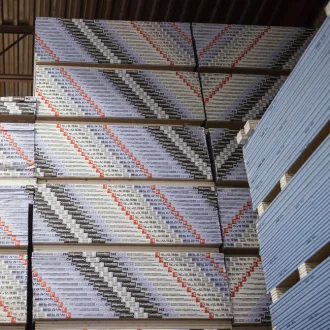 Stacks of drywall products in warehouse