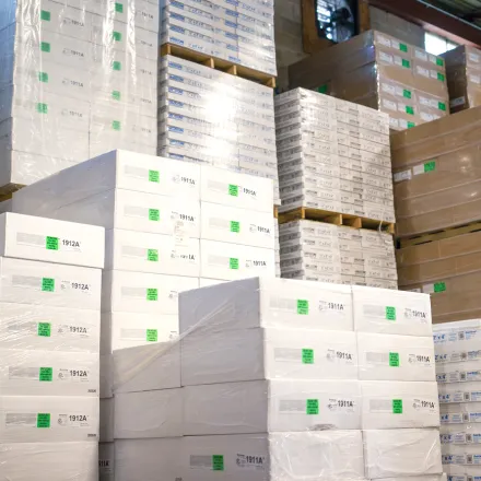 Stacks of products and boxes in warehouse